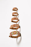 Set of five decorative dog collars with tribal artisanal patterns on a white background